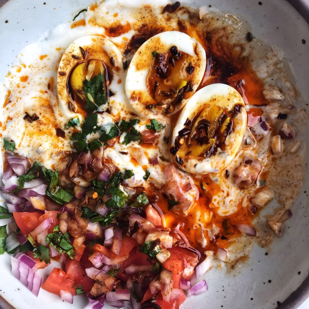 Poached Eggs with Yogurt, Tomato, Onion & Cumin Chili Oil Recipe