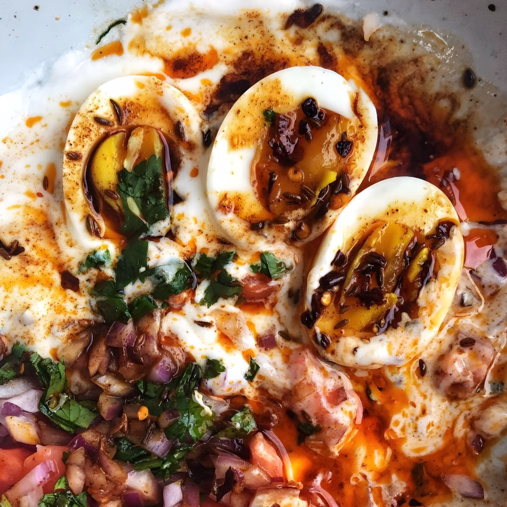 Poached Eggs with Yogurt, Tomato, Onion & Cumin Chili Oil Recipe